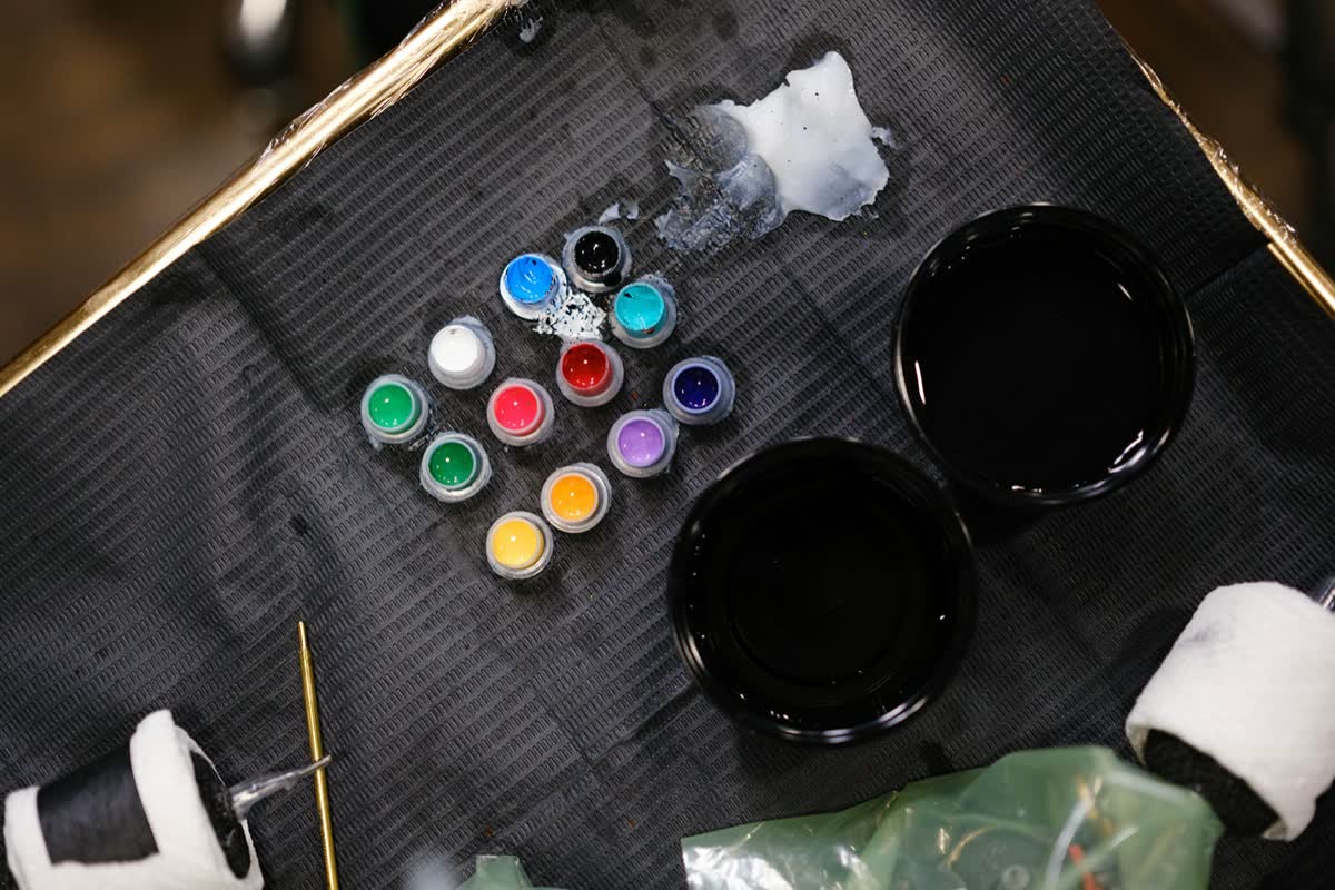 Ink caps laid out on a station before a session
